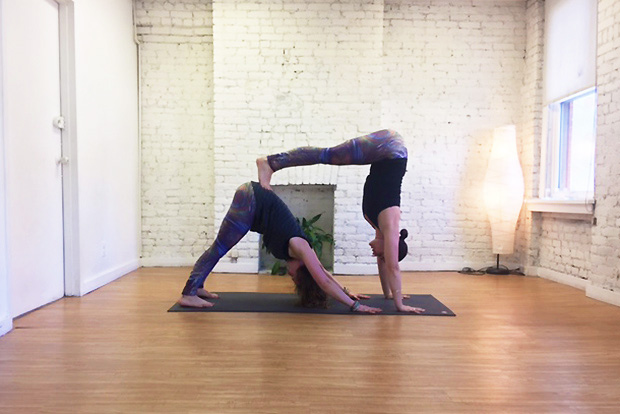 5 Beginner AcroYoga Poses That Are Totally Doable: Downward Dog L-Shape Pose