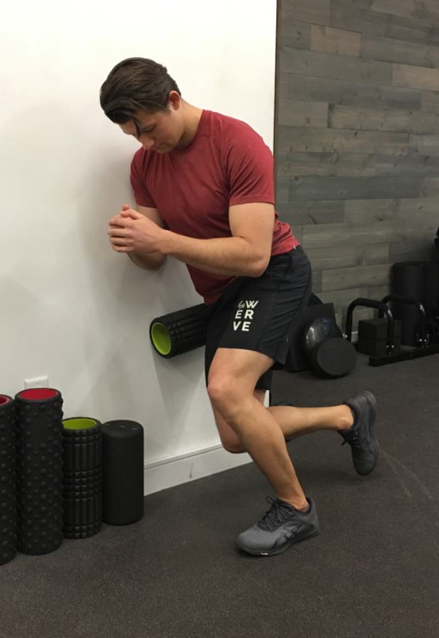 IT Band Stretches: Standing Wall Squat